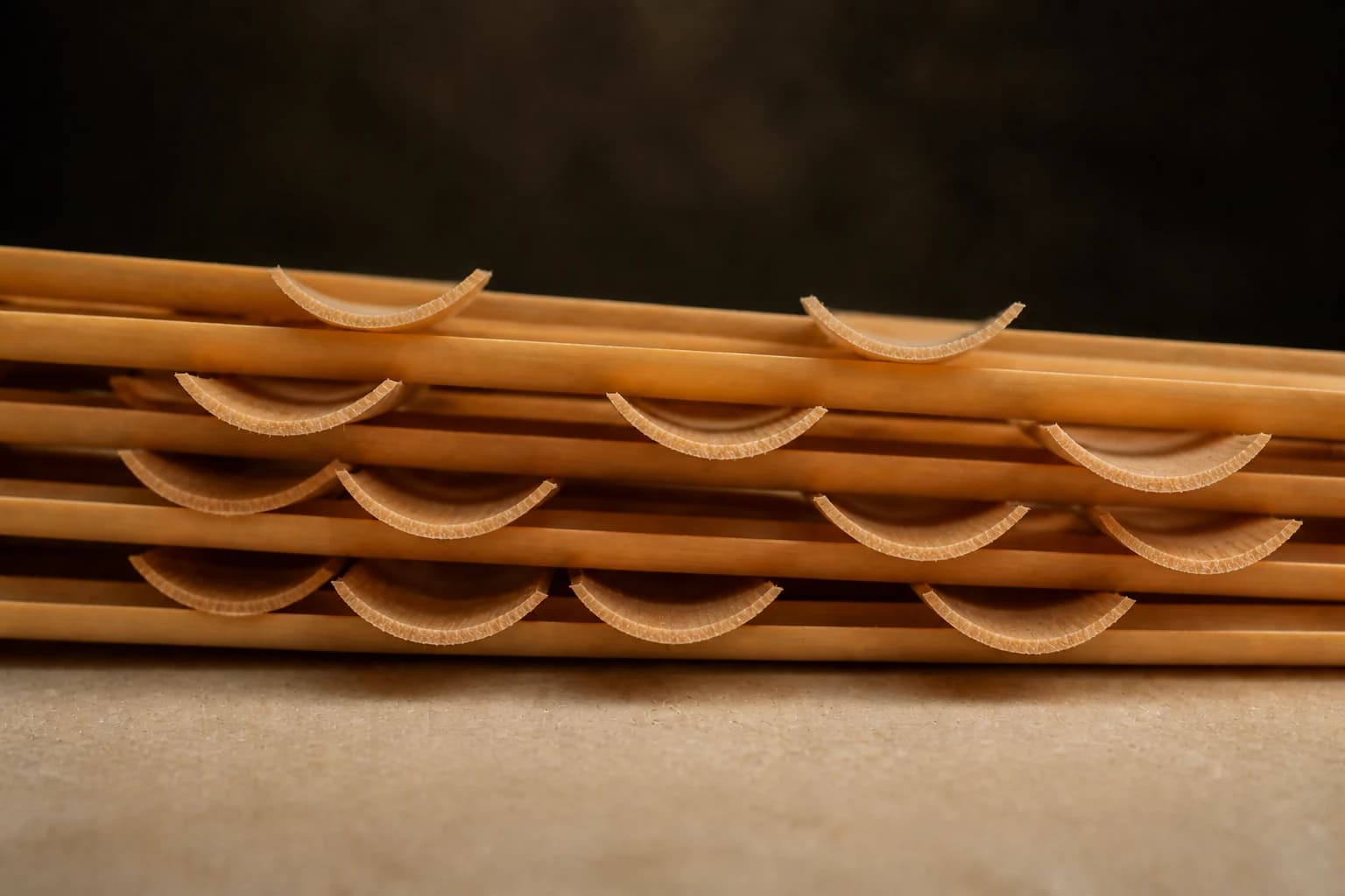 Thin concave end profiles of stacked precision-gouged oboe cane slips